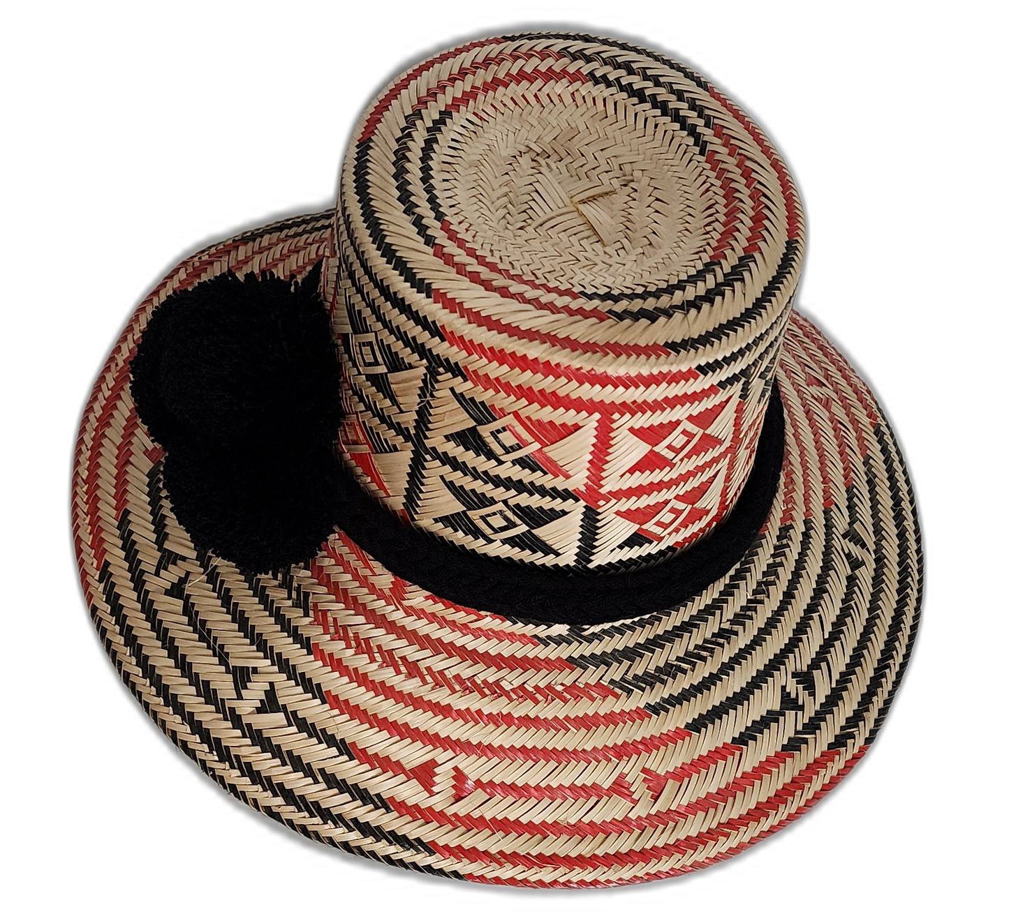 Artisan Wayuu hat in natural palm straw with black pompom detailing