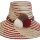 Handmade Wayuu straw hat in red and natural with white, brown, and red pompoms.Artisan boho hat with a diagonal red pattern and burgundy pompom trio

