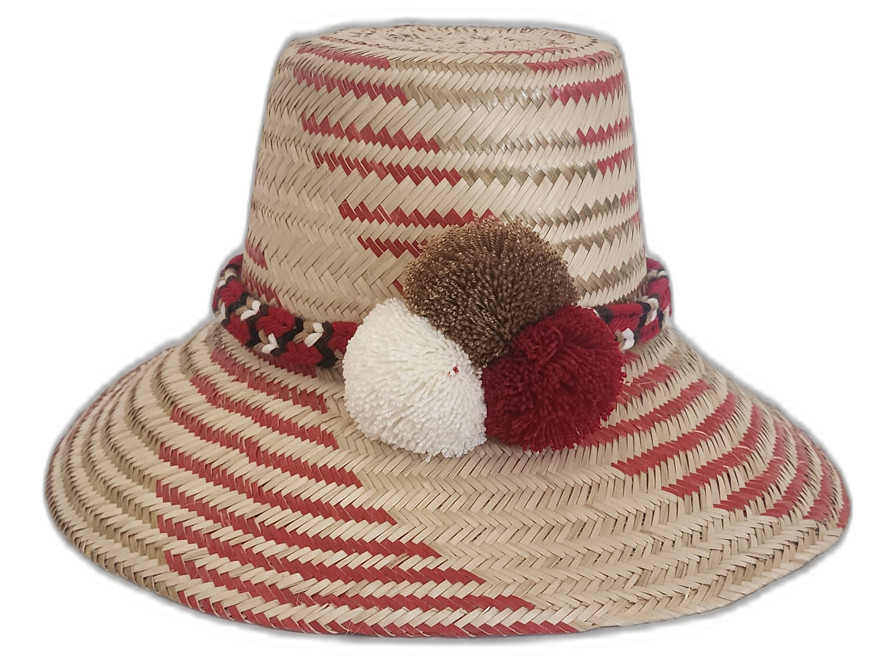 Handmade Wayuu straw hat in red and natural with white, brown, and red pompoms.Artisan boho hat with a diagonal red pattern and burgundy pompom trio

