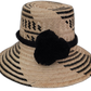 Brooke handmade Wayuu hat with minimalist black and natural weave and black pompom

