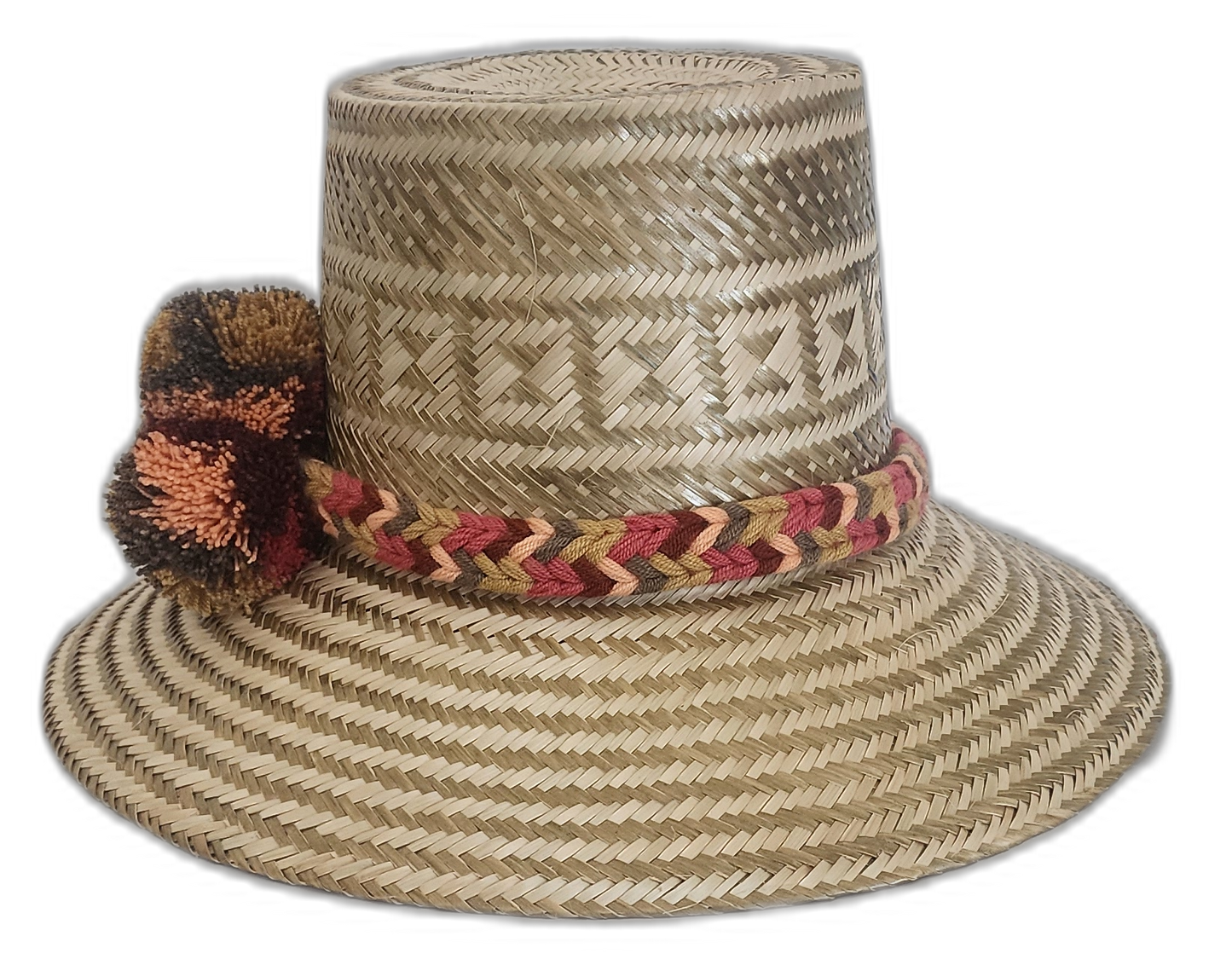 Artisan Wayuu hat with intricate weave, neutral colors, and bold pompoms