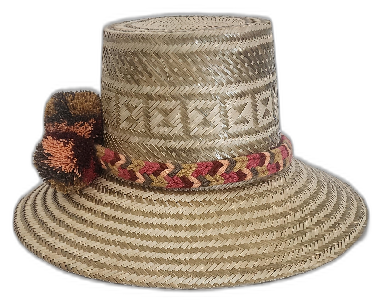Artisan Wayuu hat with intricate weave, neutral colors, and bold pompoms