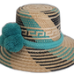 Bohemian straw hat in turquoise and black with large pompoms and artisan band.