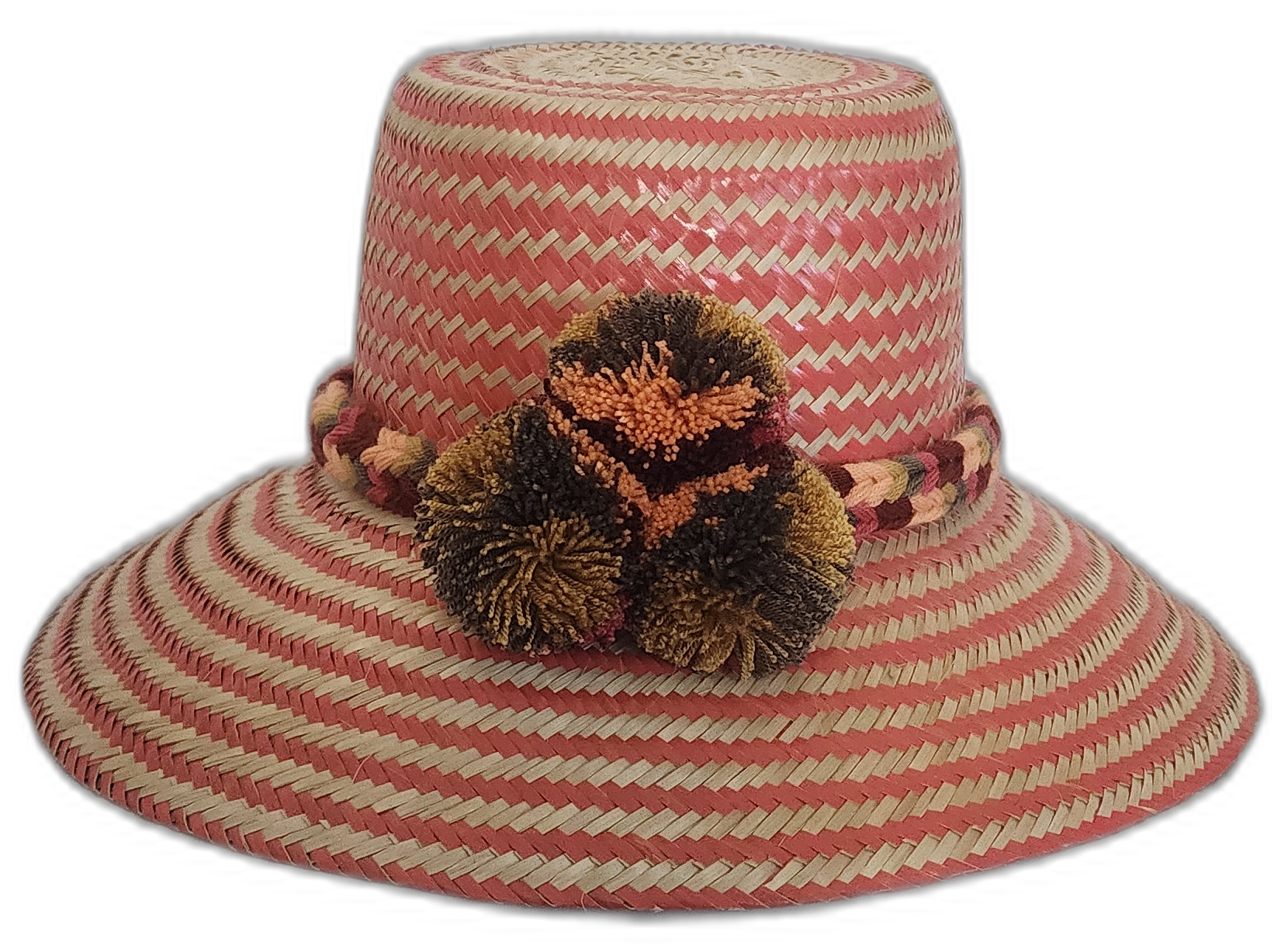 Colorful Boho Straw Hat handmade by Wayuu artisans with bold pompoms and chevron weave.Alexandra boho Wayuu hat with soft pink and beige zigzag pattern

