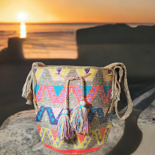 Colorful handmade Wayuu crochet bag with crystal details and vibrant tassels.