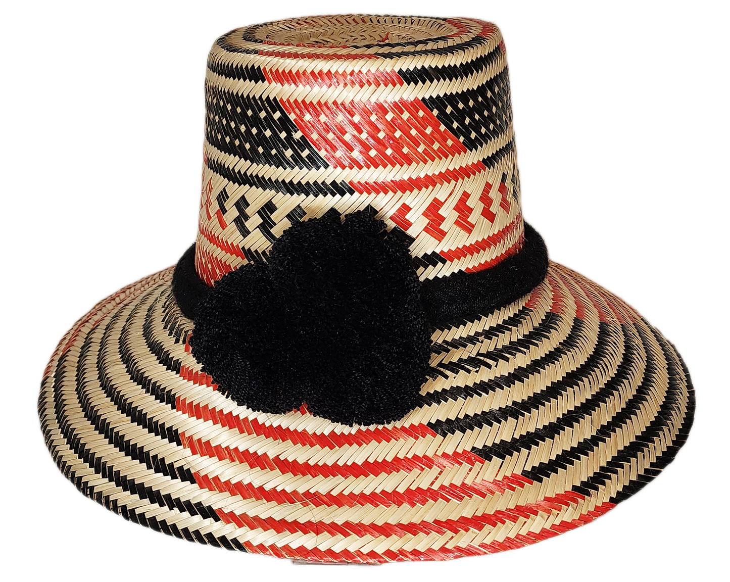 "Colorful handcrafted Artisan Wayuu hat adorned with meaningful pompoms, made from Iraca palm fibers by Wuitusu artisans."
