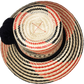 "Colorful handcrafted Artisan Wayuu hat adorned with meaningful pompoms, made from Iraca palm fibers by Wuitusu artisans."
