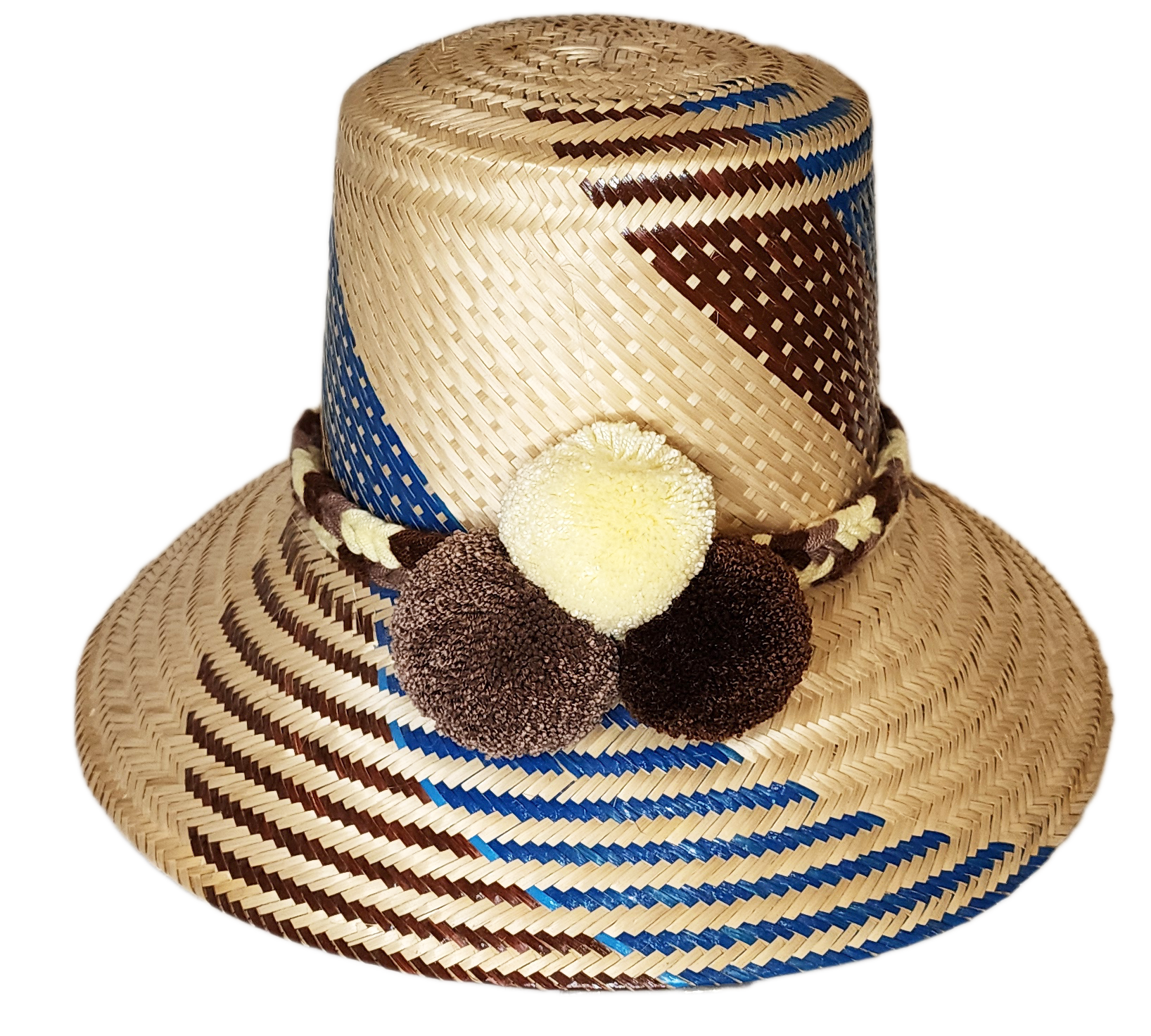 "Colorful, handcrafted Wayuu hat from Wuitusu, adorned with cultural pompoms, made from Iraca palm fibers."