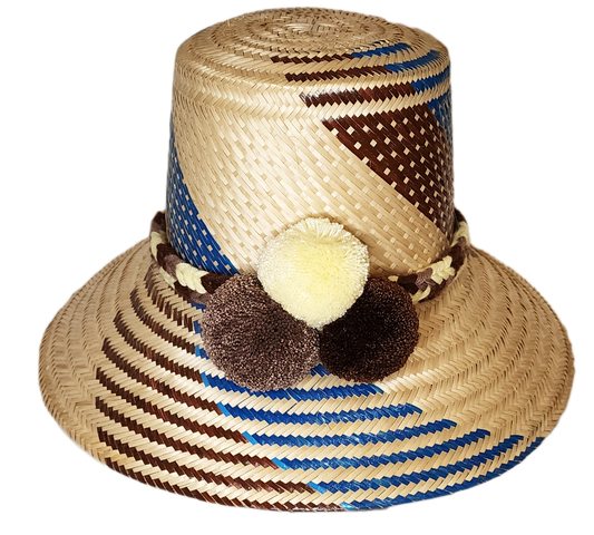 "Colorful, handcrafted Wayuu hat from Wuitusu, adorned with cultural pompoms, made from Iraca palm fibers."