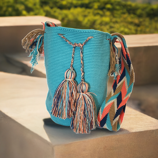 "Colorful handcrafted Wuitusu crochet bags by Wayuu women, featuring vibrant patterns and ethical fair trade practices."