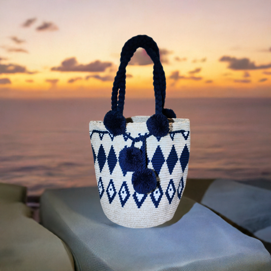 "Colorful handcrafted Wuitusu Wayuu crochet bag with a short handle, showcasing vibrant, unique patterns and fair trade craft