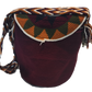 "Colorful handcrafted Wuitusu Wayuu crochet bag with lid, featuring intricate patterns and a blend of vibrant colors."