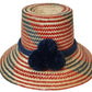 "Colorful, handmade artisan straw hat by Wuitusu, crafted by the Wayuu tribe using dyed Iraca palm fiber."