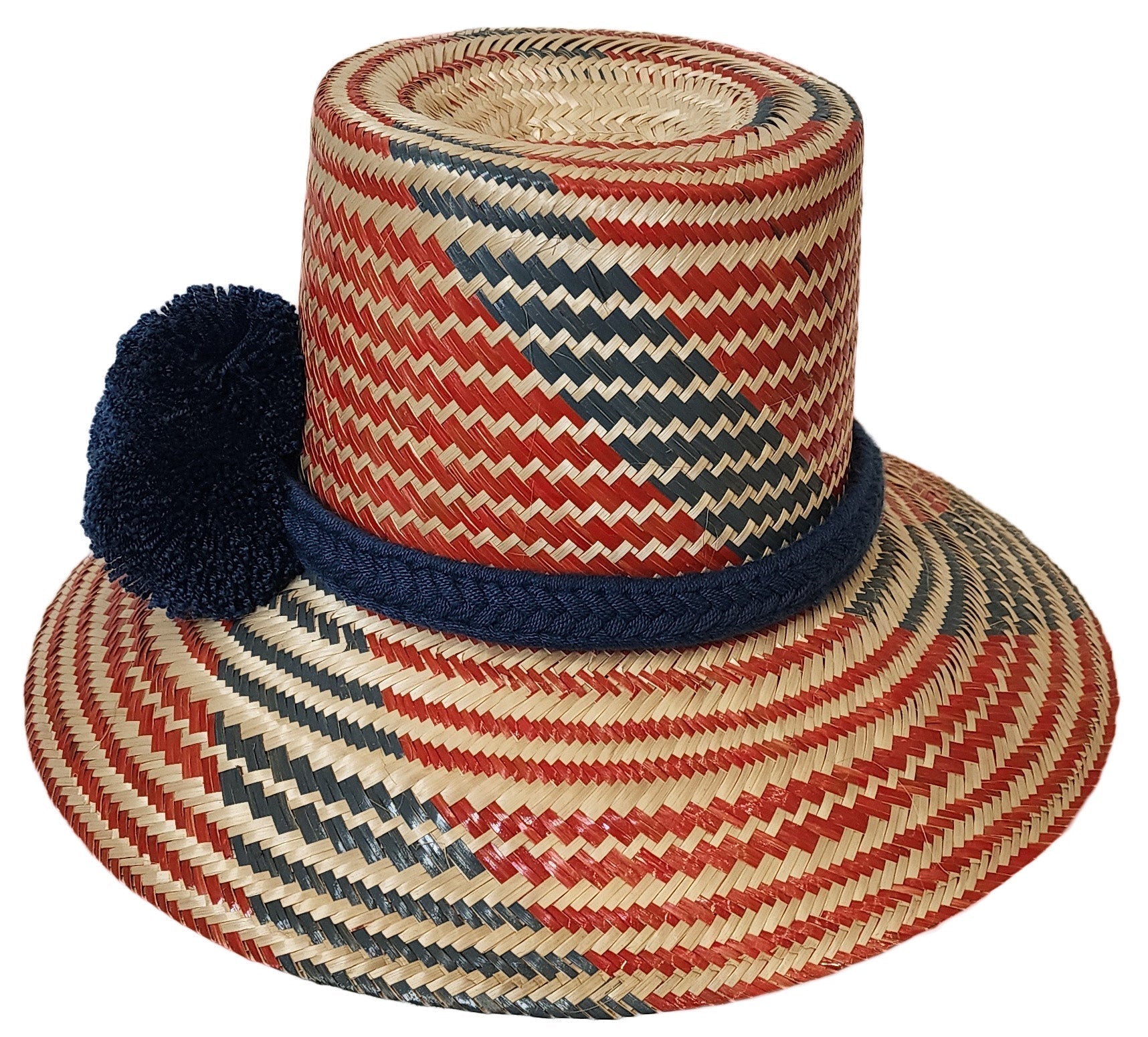 "Colorful, handmade artisan straw hat by Wuitusu, crafted by the Wayuu tribe using dyed Iraca palm fiber."