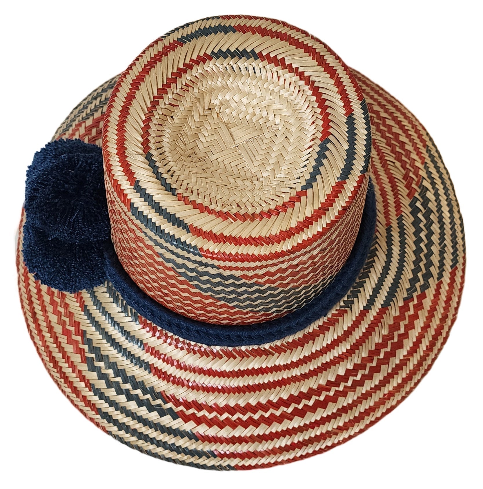 "Colorful, handmade artisan straw hat by Wuitusu, crafted by the Wayuu tribe using dyed Iraca palm fiber."
