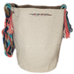 "Colorful handmade crochet bags by Wayuu women, showcasing vibrant designs and cultural emblems."