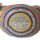 "Colorful handmade crochet crossbody bag by Wuitusu, showcasing intricate Wayuu patterns, with a flexible, long strap."