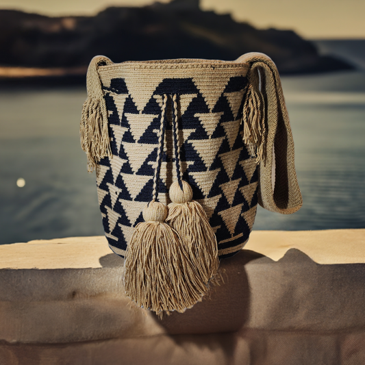 "Colorful handmade Crochet Wayuu bag crafted by the Wayuu community, featuring vibrant patterns and adjustable straps for ver