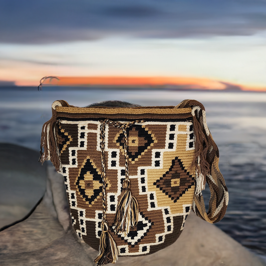 "Colorful handmade crochet Wayuu bag featuring geometric patterns, made by indigenous artisans, adjustable for shoulder or cr