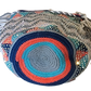 "Colorful handmade crochet Wayuu bag featuring intricate geometric patterns and a long strap, showcasing bohemian artistry an