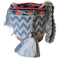 "Colorful handmade crochet Wayuu bag featuring intricate geometric patterns and a long strap, showcasing bohemian artistry an