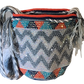 "Colorful handmade crochet Wayuu bag featuring intricate geometric patterns and a long strap, showcasing bohemian artistry an