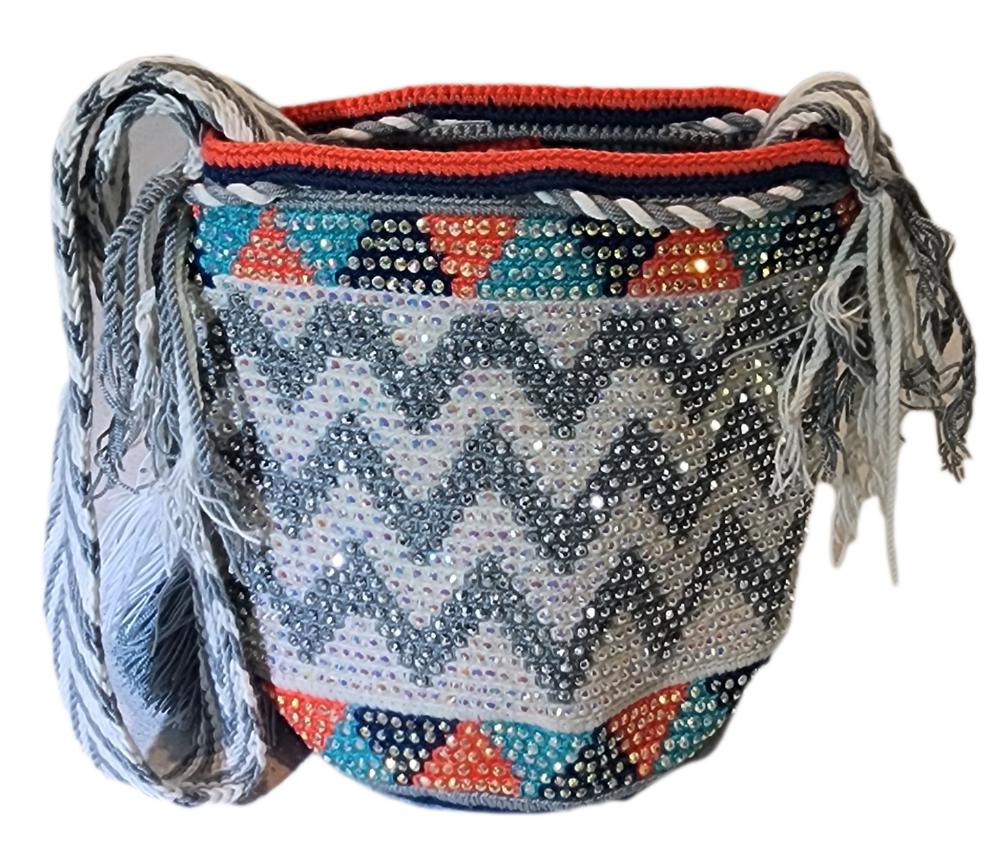 "Colorful handmade crochet Wayuu bag featuring intricate geometric patterns and a long strap, showcasing bohemian artistry an