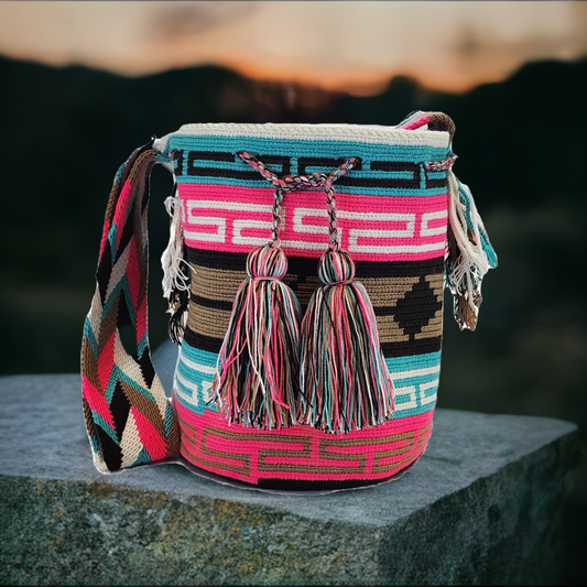 "Colorful Handmade Crochet Wayuu Bag, showcasing intricate patterns and bohemian charm, crafted by Colombian artisans."