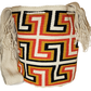 "Colorful handmade crochet Wayuu bag with adjustable strap, showcasing intricate patterns and vibrant craftsmanship."