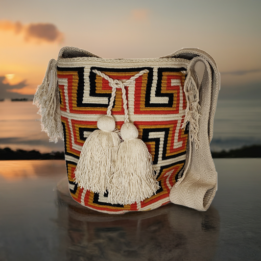 "Colorful handmade crochet Wayuu bag with adjustable strap, showcasing intricate patterns and vibrant craftsmanship."