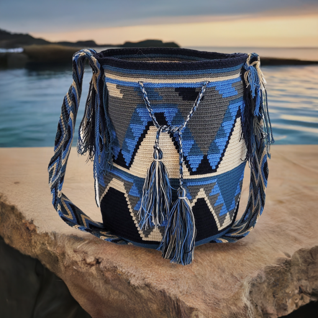 "Colorful handmade crochet Wayuu bag with adjustable straps, showcasing intricate patterns and craftsmanship."