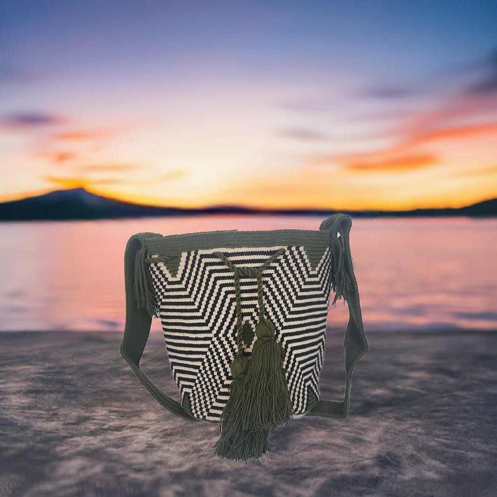 "Colorful handmade Crochet Wayuu bag with geometric motifs, crafted by indigenous artisans, perfect for versatile use."