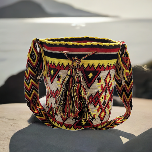 "Colorful handmade crochet Wayuu bag with intricate geometric patterns, showcasing traditional artisan craftsmanship."