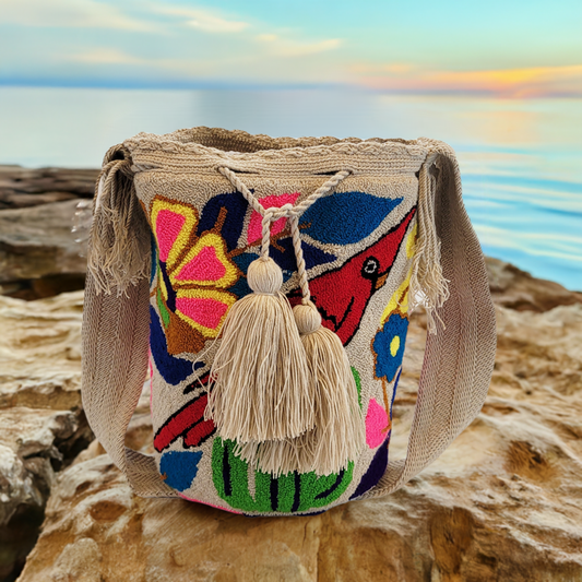 "Colorful handmade crochet Wayuu bag with vibrant geometric patterns, showcasing artisan craftsmanship and bohemian style."