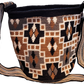 "Colorful handmade Paleteada Crochet Wayuu Bag by Wuitusu, showcasing unique geometric patterns and adjustable strap."