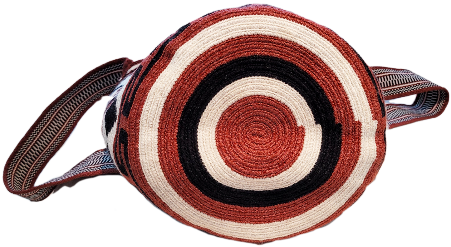 "Colorful handmade Paleteada Wayuu crochet bag with adjustable straps, showcasing traditional geometric patterns and supporti