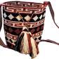 "Colorful handmade Paleteada Wayuu crochet bag with adjustable straps, showcasing traditional geometric patterns and supporti