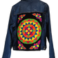 "Colorful handmade punch needle denim jacket with vibrant Wayuu-inspired embroidery, showcasing bohemian style and craftsmans