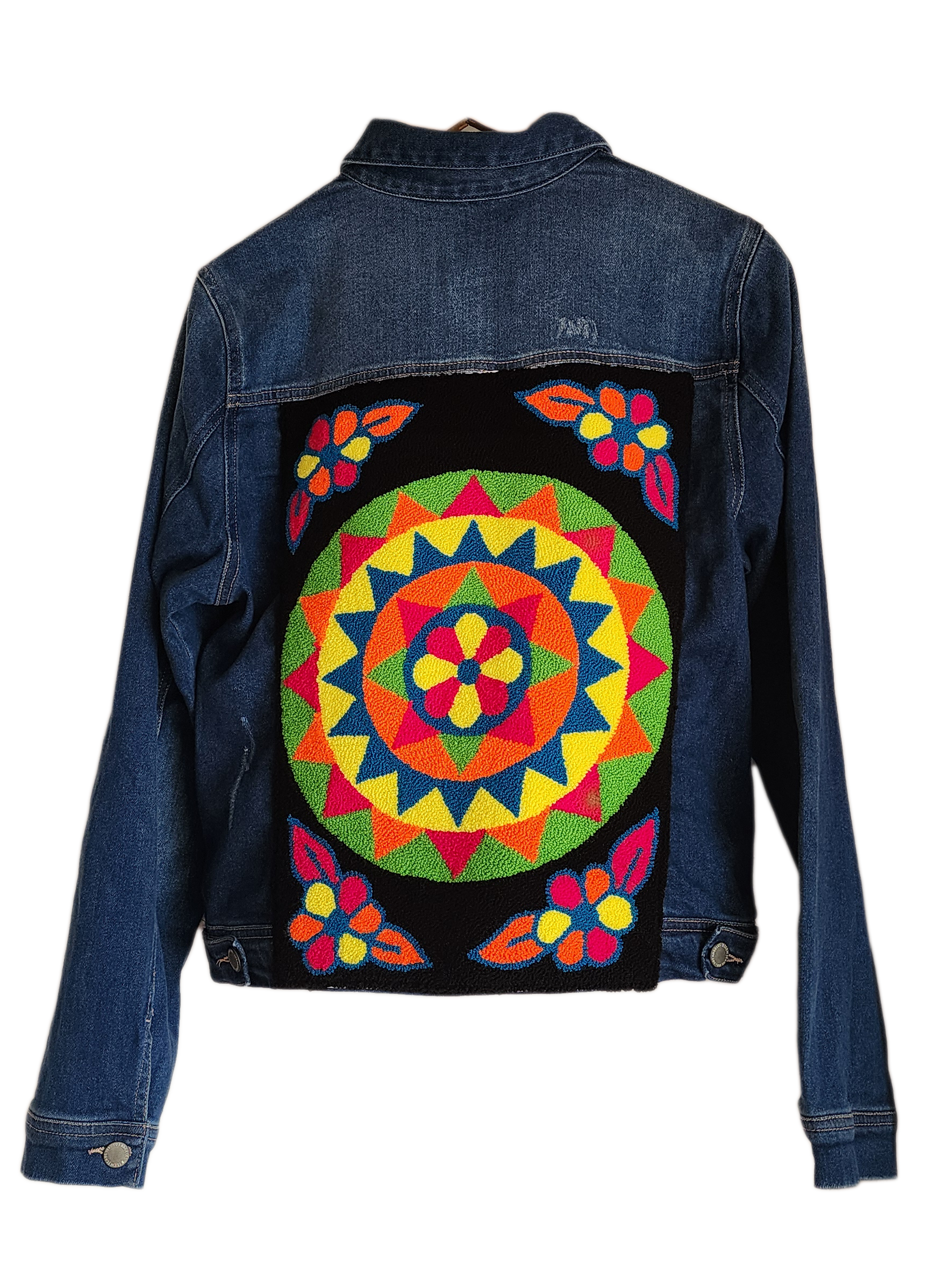 "Colorful handmade punch needle denim jacket with vibrant Wayuu-inspired embroidery, showcasing bohemian style and craftsmans