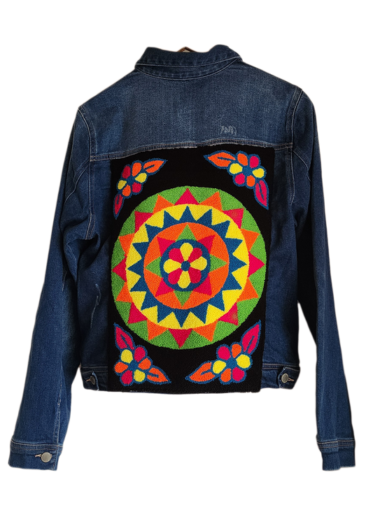 "Colorful handmade punch needle denim jacket with vibrant Wayuu-inspired embroidery, showcasing bohemian style and craftsmans
