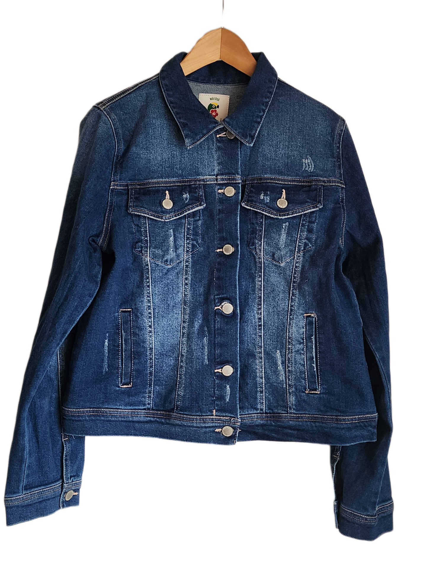 "Colorful handmade punch needle denim jacket with vibrant Wayuu-inspired embroidery, showcasing bohemian style and craftsmans