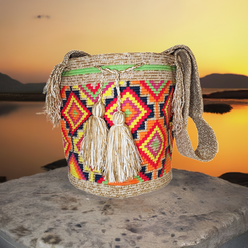 "Colorful handmade Wayuu crochet bag, adjustable strap, reflects vibrant Bohemian artistry and Wayuu heritage."