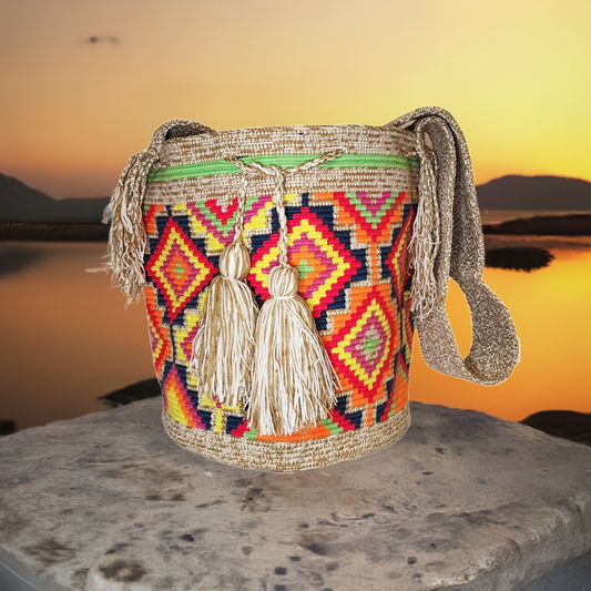 "Colorful handmade Wayuu crochet bag, adjustable strap, reflects vibrant Bohemian artistry and Wayuu heritage."