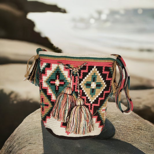 "Colorful handmade Wayuu crochet bag, featuring intricate patterns and a boho design, ideal for versatile use."