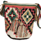 "Colorful handmade Wayuu crochet bag, featuring intricate patterns and a boho design, ideal for versatile use."
