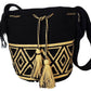 "Colorful handmade Wayuu crochet bag showcasing vibrant geometric patterns and adjustable straps, perfect for versatile use."