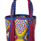 "Colorful handmade Wayuu crochet bag with a cascading waterfall design, crafted by skilled artisans, ideal for various occasi