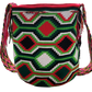 "Colorful handmade Wayuu crochet bag with adjustable strap for shoulder or crossbody wear, showcasing unique boho patterns."