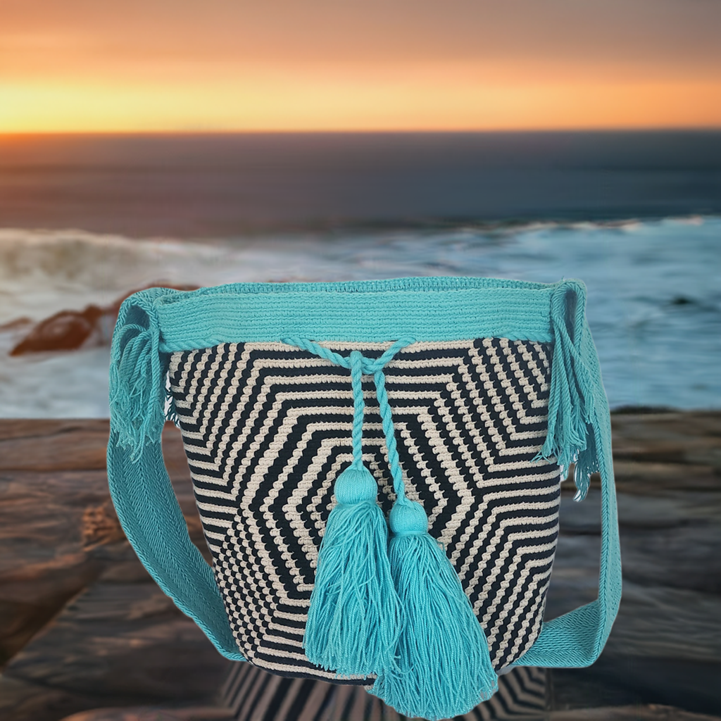 "Colorful handmade Wayuu crochet bag with geometric designs, crafted by indigenous artisans, adjustable strap for versatile w