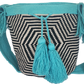 "Colorful handmade Wayuu crochet bag with geometric designs, crafted by indigenous artisans, adjustable strap for versatile w